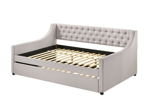 The fully upholstered daybed embodies a classic aesthetic infused with rich textures. Wooden frame is graced with gentle curves and elegant details while button-tufted fog fabric upholstery makes you indulge in a luxurious comfort. An additional trundle u