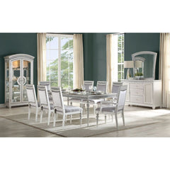 Make your dining room the centerpiece of your home with the Maverick dining set. This unique set comes in a platinum finish and sparkling rhinestone. The removable extension leaf which will create plenty of seating space and a welcoming place for all thos