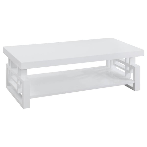 This modern rectangular coffee table adds sleek style to any living room. Crafted from durable engineered wood, it boasts a pristine white high-gloss finish that reflects light beautifully. The open shelf below offers practical storage, while the geometri