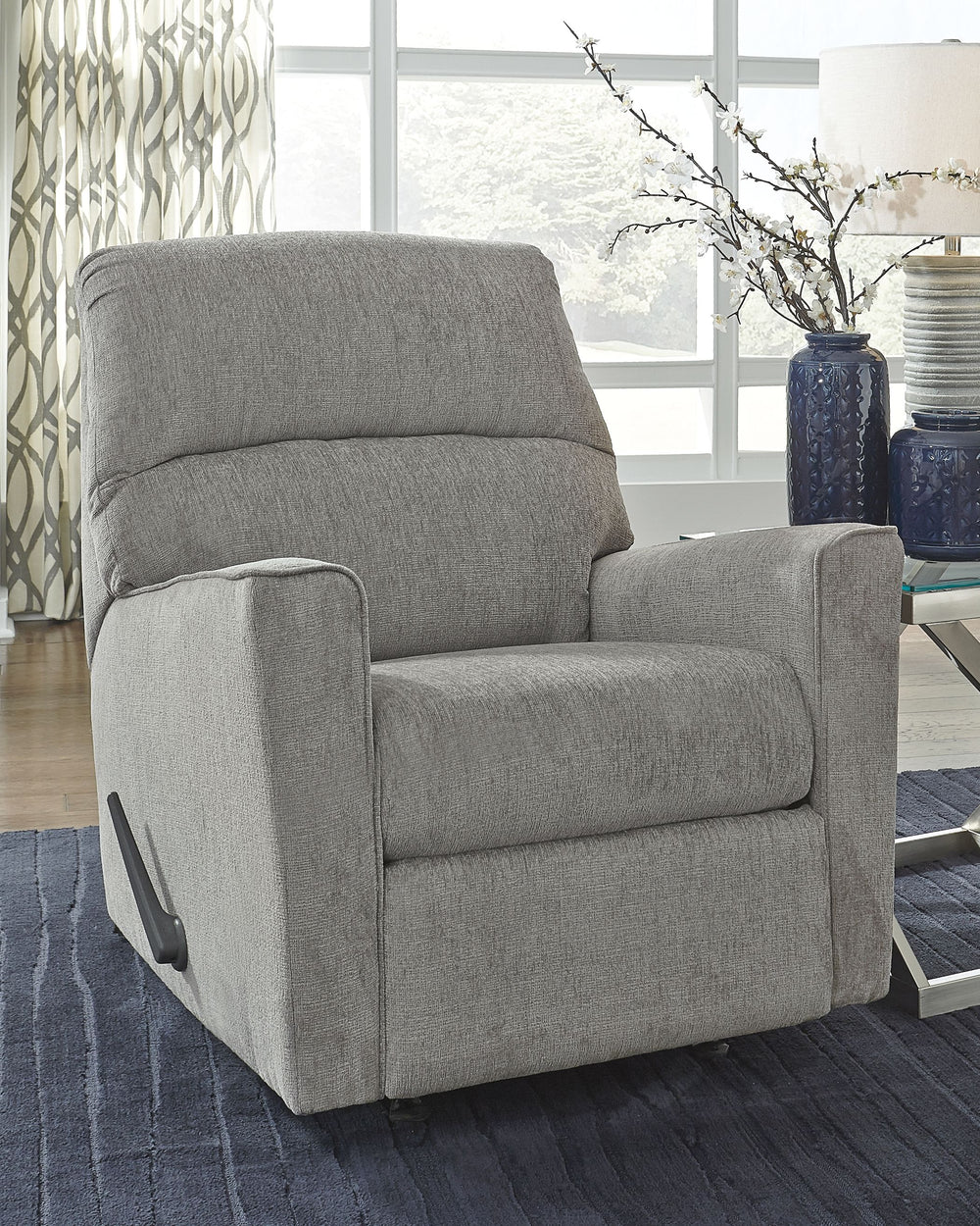 If style is the question, then this rocker recliner is the answer. Clean-lined profile is beautifully contemporary. Plush chenille fabric and plump cushioning make it so easy to comfortably kick up your heels. Richly neutral hue complements a variety of d