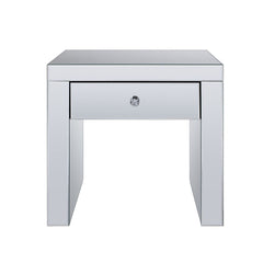 The Noralie End Table will give any room a touch of glamour. This contemporary end table is fully mirrored with a stunning mirror top and a faux diamonds inlay on each leg of its sled base. Use this unique piece as the perfect accent for any room Decor. O