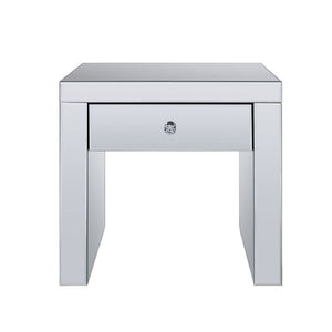 The Noralie End Table will give any room a touch of glamour. This contemporary end table is fully mirrored with a stunning mirror top and a faux diamonds inlay on each leg of its sled base. Use this unique piece as the perfect accent for any room Decor. O