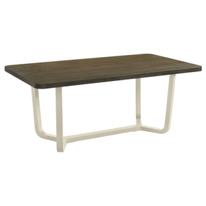 Refresh your dining room with this eye-catching modern dining table. The table features a rectangular top with rich wood grain details and smooth, rounded corners that add a sleek, welcoming touch. Supported by a bold, angular white base, the two-tone fin