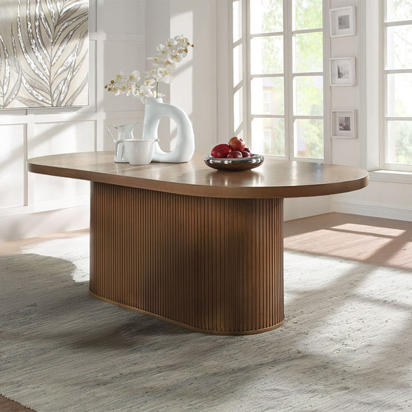 The Gamarya dining collection is designed to provide space for your guests in effortless convenience and tasteful style. This dining collection offers a contemporary vibe to your dining space. The oval tabletop and vertical reeding on the pedestal base le