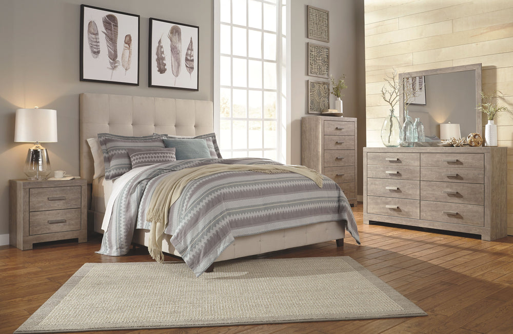 A sophisticated modern chunky look with large satin nickel colored hardware. Warm gray vintage finish with subtle pearl effect over replicated cherry grain. Mouldings across headboard give a thick planked look. Side roller glides for smooth operating draw