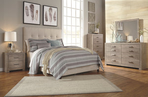 A sophisticated modern chunky look with large satin nickel colored hardware. Warm gray vintage finish with subtle pearl effect over replicated cherry grain. Mouldings across headboard give a thick planked look. Side roller glides for smooth operating draw