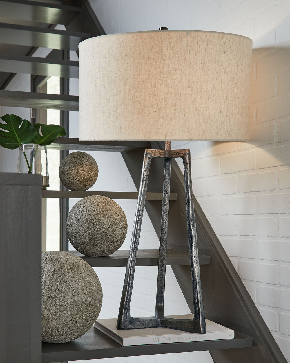 With its structural metal base and antiqued pewter-tone finish, this table lamp takes a decidedly different stance on style. Whether youâ€™re a fan of vintage chic or industrial hip, itâ€™s an illuminating choice.<br><br><b>Additional Dimensions</b><br><u