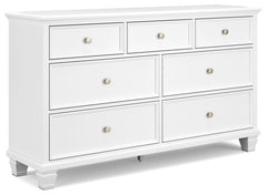 This dresser exudes timeless casual design that-'s ready to define your personal space. Its clean, contemporary white finish, framed drawer fronts and round metal knobs easily adapt to a variety of interiors. Featuring seven storage drawers with dovetail 
