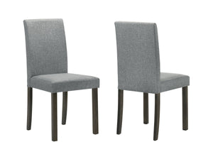 This dining group is a perfect fusion of minimalist design and everyday practicality. The sleek, rectangular table boasts a smooth, dark wood finish that adds a touch of sophistication to any dining space. Complemented by four comfortable upholstered chai