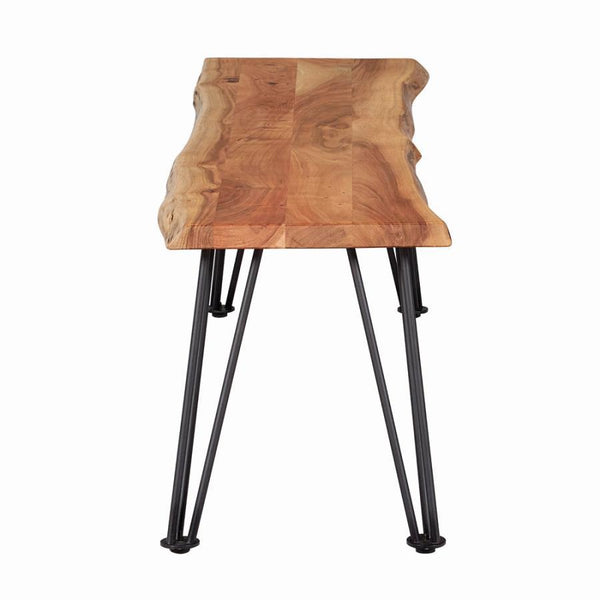  the bench top features an exposed wood grain with slight distressing. Contrasting against this warmth is the 