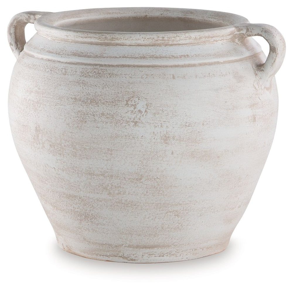 Celebrate the artisanal character of ceramics with this vase. Its distressed white finish has a time-worn, weathered appeal, offering the look of the past with a modern feel. The vase-'s neutral tone makes it a go-to for all seasons, allowing you to stage
