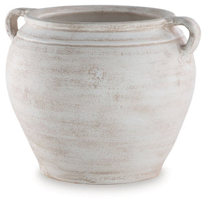 Celebrate the artisanal character of ceramics with this vase. Its distressed white finish has a time-worn, weathered appeal, offering the look of the past with a modern feel. The vase-'s neutral tone makes it a go-to for all seasons, allowing you to stage