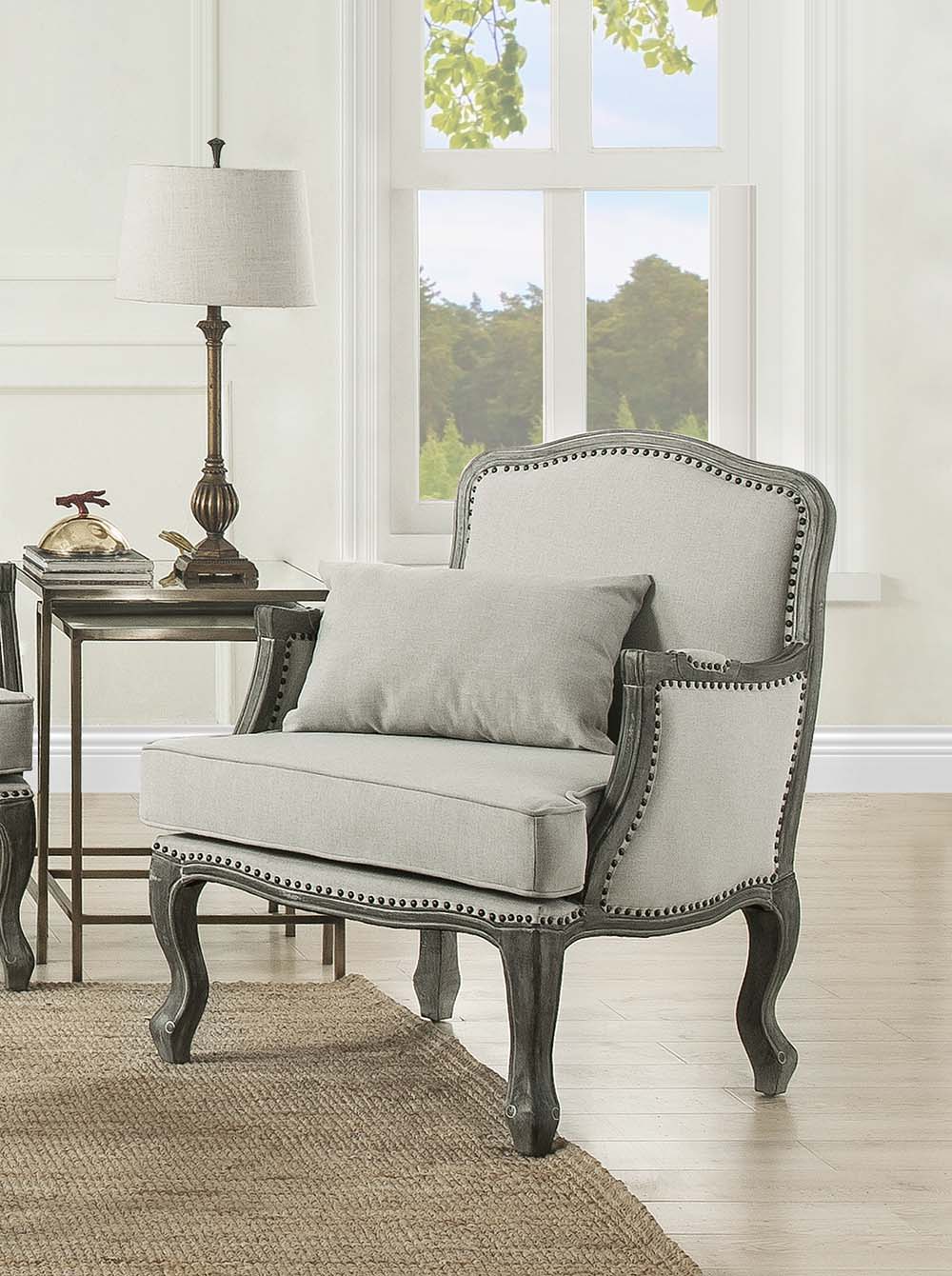 Finely crafted with superb carved details and a lovely natural finish, the Tania sofa flaunts a French cabriole silhouette that perches on graceful cabriole legs and showcases its antique-inspired profile. The nailhead trim accents give this piece a moder