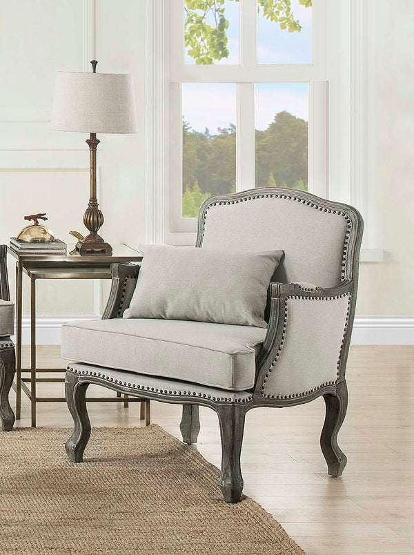 Finely crafted with superb carved details and a lovely natural finish, the Tania sofa flaunts a French cabriole silhouette that perches on graceful cabriole legs and showcases its antique-inspired profile. The nailhead trim accents give this piece a moder