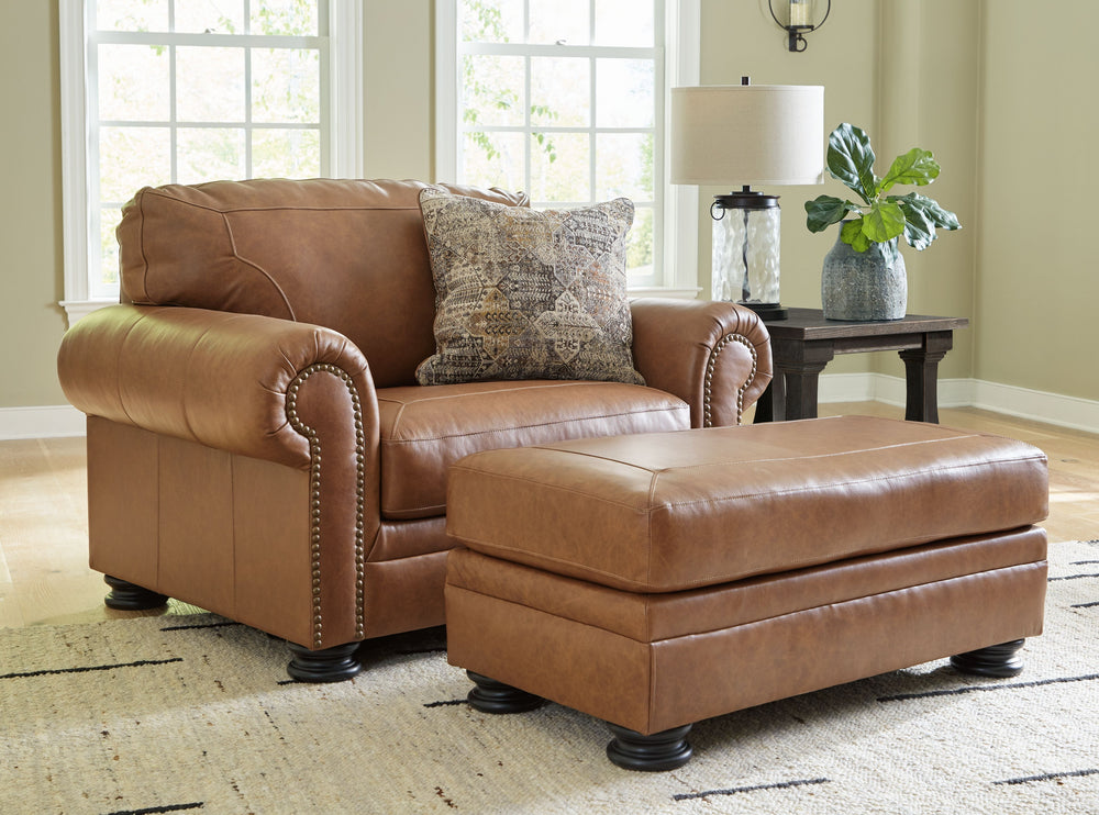 Merging traditional motifs with a modern hue, this living room set ties your transitional seating area together. Classic roll arms decorated with nailhead trim bookend the comfortable cushions for a bit of extra flair. Itâ€™s approachable, yet luxurious. 