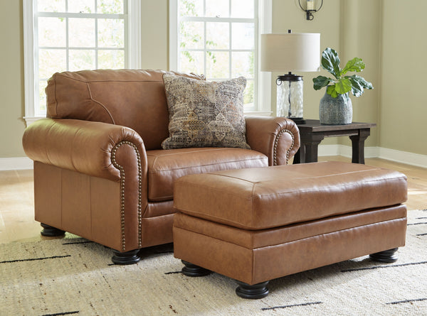 Merging traditional motifs with a modern hue, this living room set ties your transitional seating area together. Classic roll arms decorated with nailhead trim bookend the comfortable cushions for a bit of extra flair. Itâ€™s approachable, yet luxurious. 