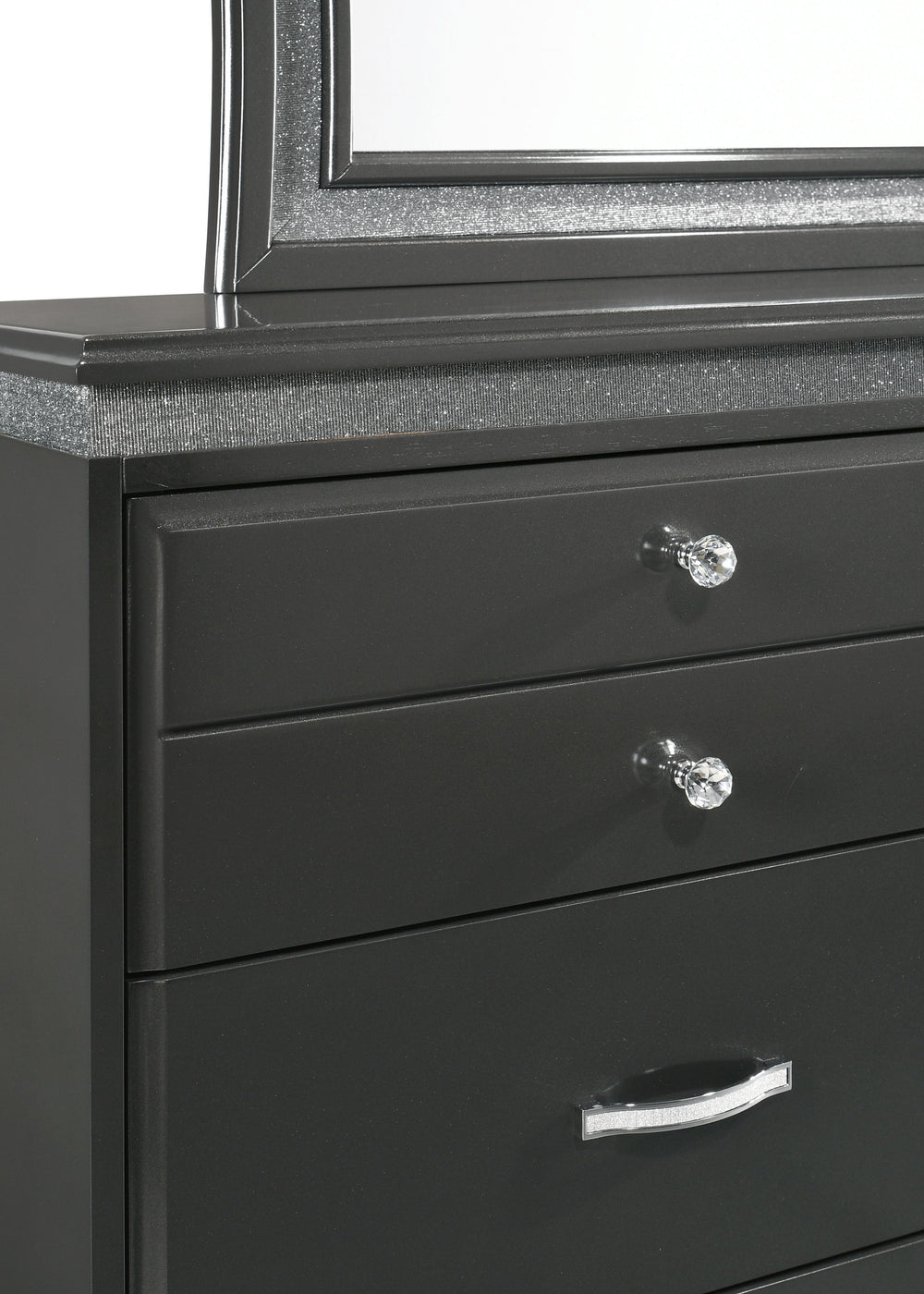 This elegant bedroom collection exudes sophistication with its bold, modern design and luxurious finishes. The centerpiece, a plush upholstered bed, features a high, statement-making headboard with distinctive channel tufting and a shimmering border, offe