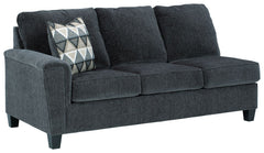 This left-arm facing sofa with corner wedge is made with polyester upholstery. Pairs with other items in the series to make a sectional.<br><br><b>Additional Dimensions</b><br><ul><li>Arm height: 27-"</li><li>Leg height: 4.5-"</li><li>Minimum width of doo