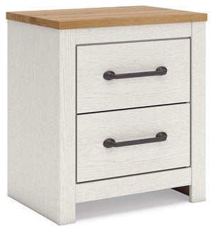 Create a serene countryside retreat with this nightstand. The two-tone design effortlessly adds farmhouse style, while framed drawer fronts with pewter-tone handles enhance its charming appeal. Looking for furniture that offers storage and a peaceful esca