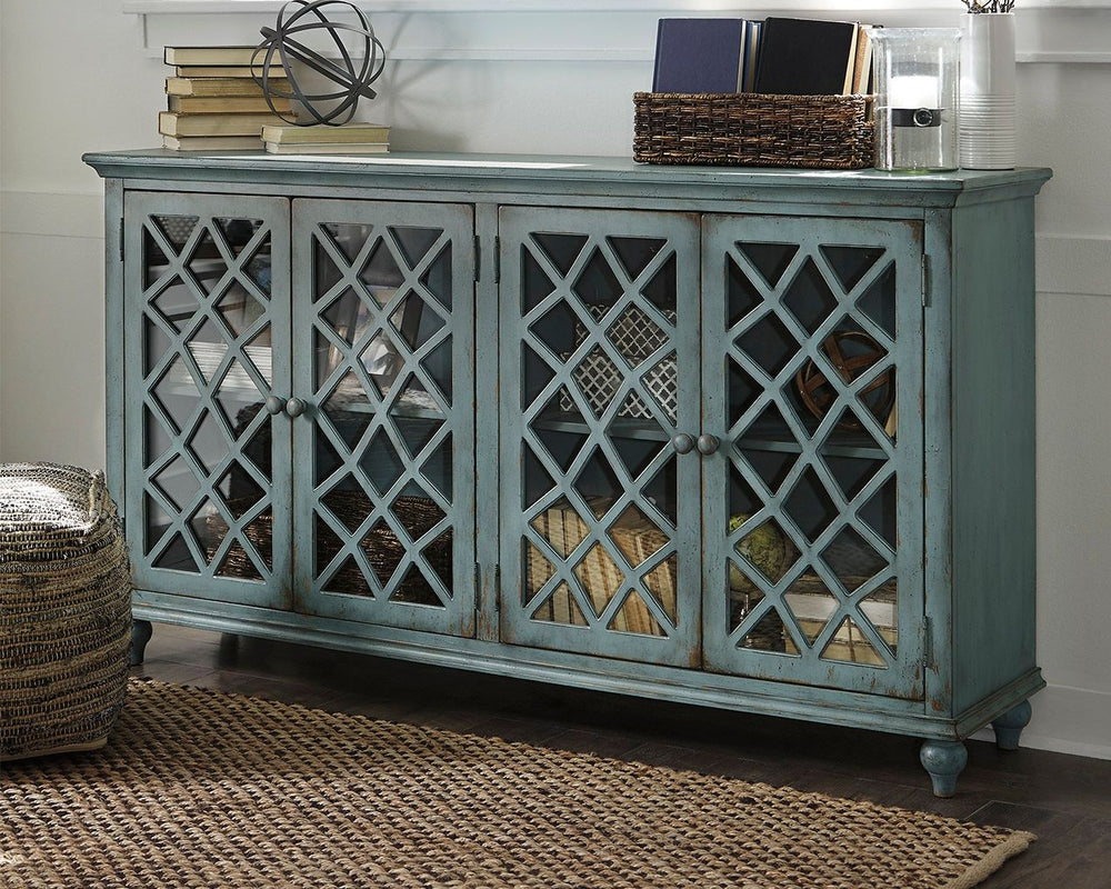 Put your love of shabby chic style on display with this wonderfully versatile cabinet. Adding to the charm of its distressed vintage paint finish: glass-inlay doors with a â€œfree formâ€ lattice design thatâ€™s delightfully different. Adjustable shelved 