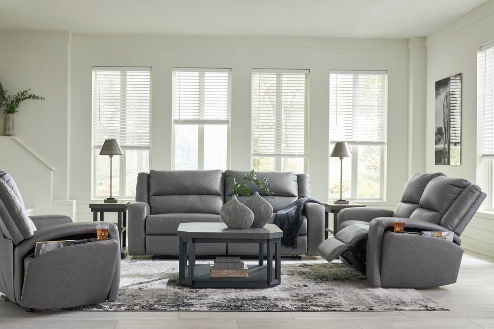 This reclining sofa and loveseat with matching recliner set appeals to your love for feature-filled furniture, all while maintaining a clean-lined and contemporary design. Pop-out storage and cup holders keep essentials close when you need them and tuck a