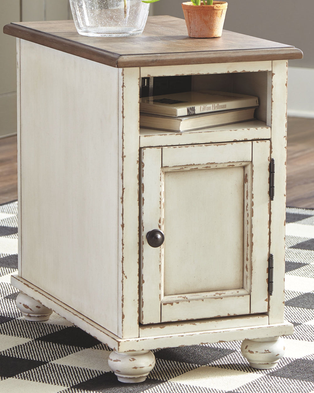 This chairside end table is traditional cottage styling made for modern living. Antiqued two-tone finish blends a chipped white with a distressed wood finished top for a double serving of charm. Cleverly placed AC power outlets and USB charging ports are 