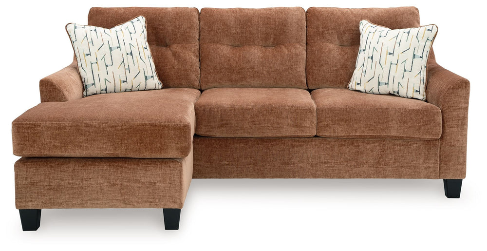 Urban contemporary meets mid century (with a pop of trend-right color) in this sofa chaise. Supremely soft upholstery, teeming with luster and movement, finesses the piece with just the right touch. Gently flared arms and tufted back cushions let you bask