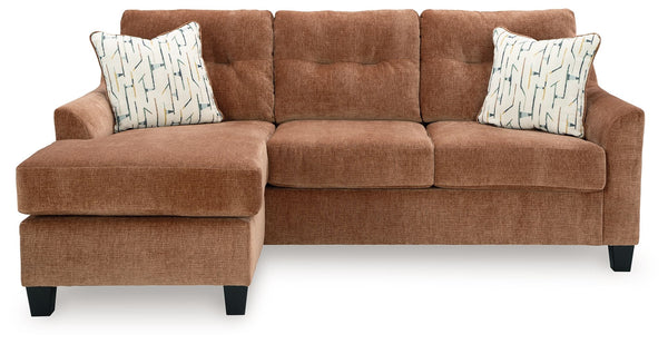 Urban contemporary meets mid century (with a pop of trend-right color) in this sofa chaise. Supremely soft upholstery, teeming with luster and movement, finesses the piece with just the right touch. Gently flared arms and tufted back cushions let you bask