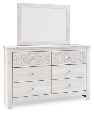 If itâ€™s coastal chic or cottage quaint style you long for, this whitewashed dresser and mirror set invites you to go to town. Its distinctive weatherworn finish conveys an easy-breezy sensibility: perfect for a restful bedroom retreat. Tastefully edited