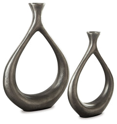 Make a splash with this vase set. The teardrop design with a cutout center is so eye opening. An antiqued silvertone finish is a striking contrast to the vasesâ€™ modern flair.<br><br><b>Additional Dimensions</b><br><ul><li>Vase-small: 0-"</li><li>Vase-la