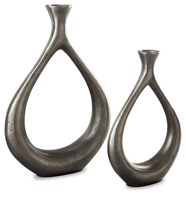 Make a splash with this vase set. The teardrop design with a cutout center is so eye opening. An antiqued silvertone finish is a striking contrast to the vasesâ€™ modern flair.<br><br><b>Additional Dimensions</b><br><ul><li>Vase-small: 0-"</li><li>Vase-la