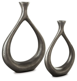 Make a splash with this vase set. The teardrop design with a cutout center is so eye opening. An antiqued silvertone finish is a striking contrast to the vasesâ€™ modern flair.<br><br><b>Additional Dimensions</b><br><ul><li>Vase-small: 0-"</li><li>Vase-la