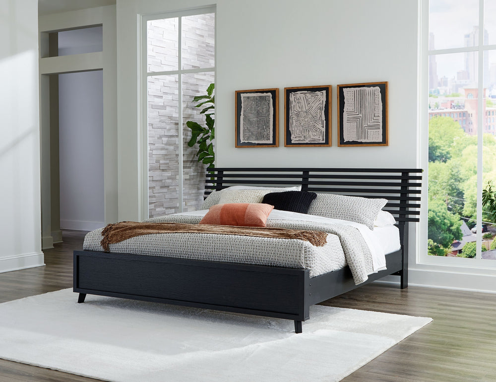Sophisticated style for the savvy shopper. This panel bed prioritizes affordable, on-trend design. Its subtle replicated texture recalls the natural beauty of wood, highlighting the slatted styling. And a matte black finish savvily suits different approac