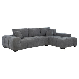 Embrace comfort and timeless style with this mid-century inspired sectional sofa. Designed for relaxed lounging, it showcases wide, rounded arms and plush waterfall seat cushions adorned with subtle grid tufting. Soft, neutral upholstery envelops a sturdy