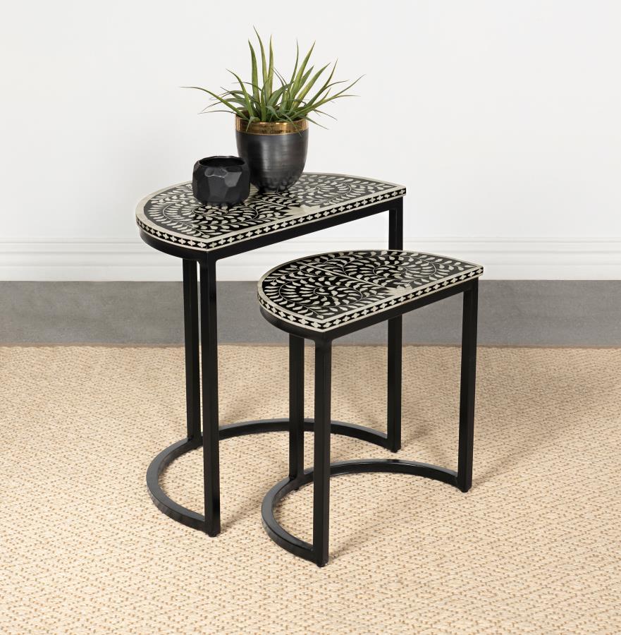 Artisan and exotic describes this elegant nesting table set with two tables that bring pure style to any living space. The Zakiya two-piece nesting table set conquers your serving needs while adding a bold and exquisite aesthetic. Set up a living room to 
