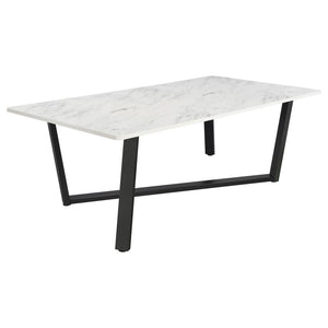 Strikingly modern with a classic twist, this dining table features a spacious faux marble top and an asymmetrical gunmetal metal base. The clean white surface offers the elegant look of marble with easy-care convenience, while the bold leg design brings a