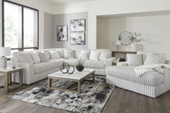 Donâ€™t want to sacrifice standout style for majorly cozy seating? This set pairs bold character with sink-in comfort. Its retro-cool jumbo cord over feather-blend cushions creates a luxuriously soft lounging experience. With this sectional and chaise, yo
