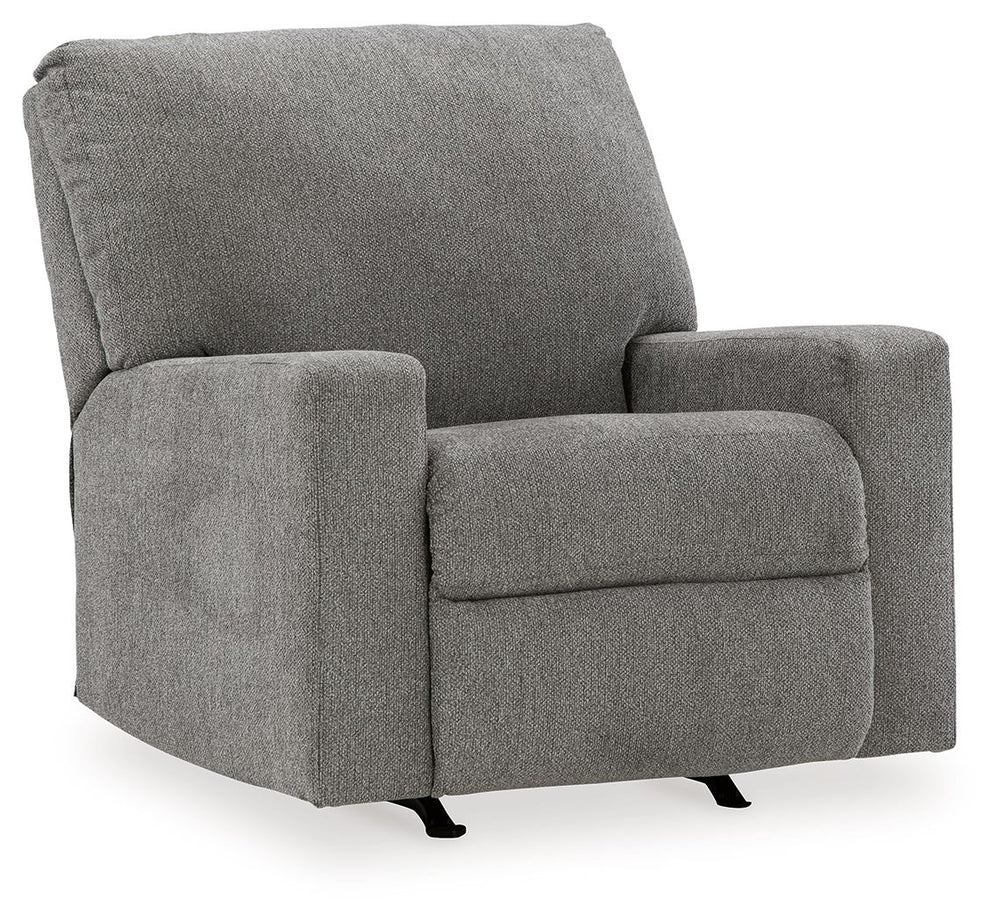 Youâ€™re in for a neat treat with this rocker recliner. Its comfy seat is covered in soft, textural upholstery, and the wide track arms are eager to support your quest for total relaxation. A side button reclines the seating to a relaxing position. Or sim