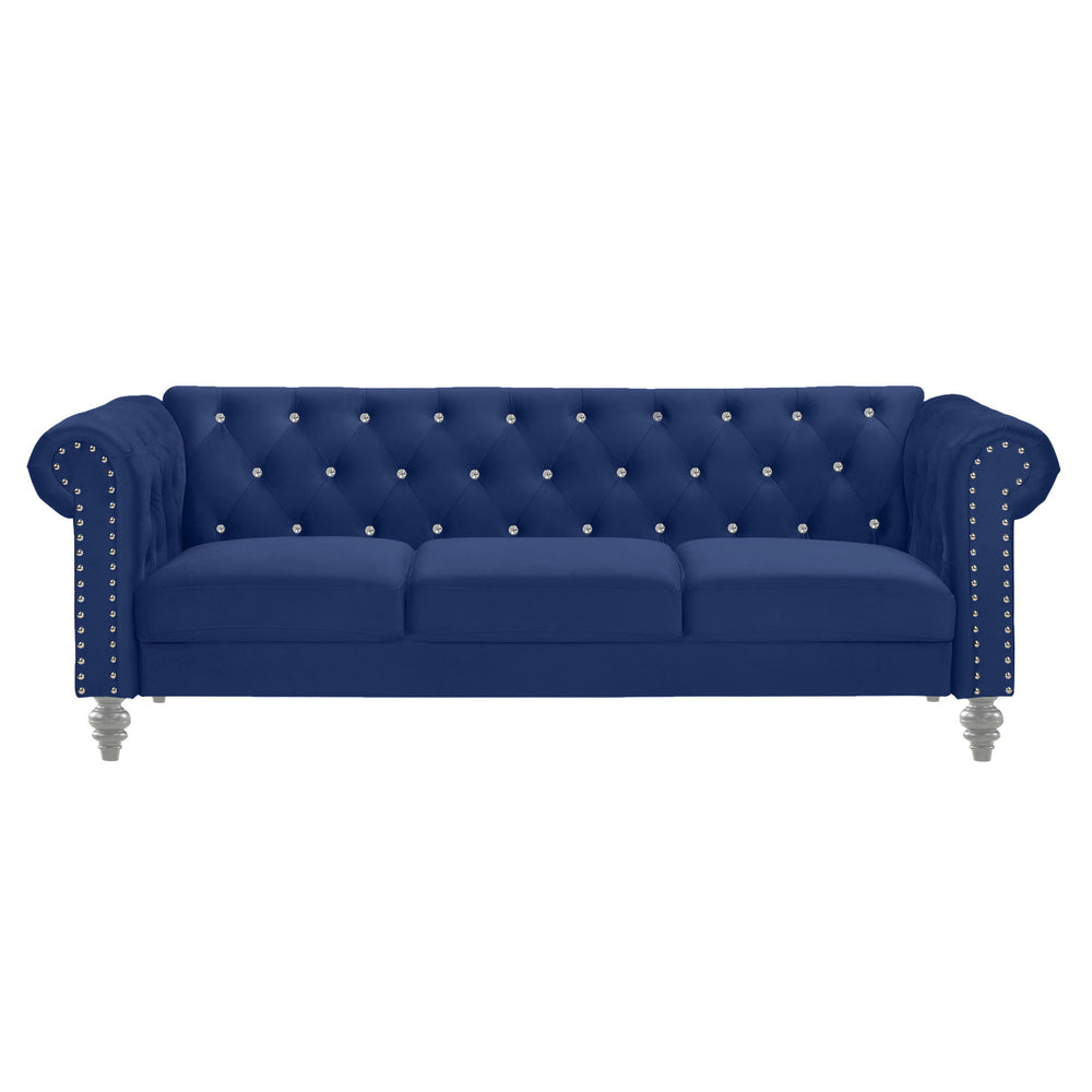 The New Classic Emma Chesterfield Velvet 3 Seat Sofa is a blend of soft elegance and sophisticated design. Crafted from 100% polyester velvet fabric, it offers cozy and indulgent seating for three. The glam tailoring features tufted backs and arms adorned