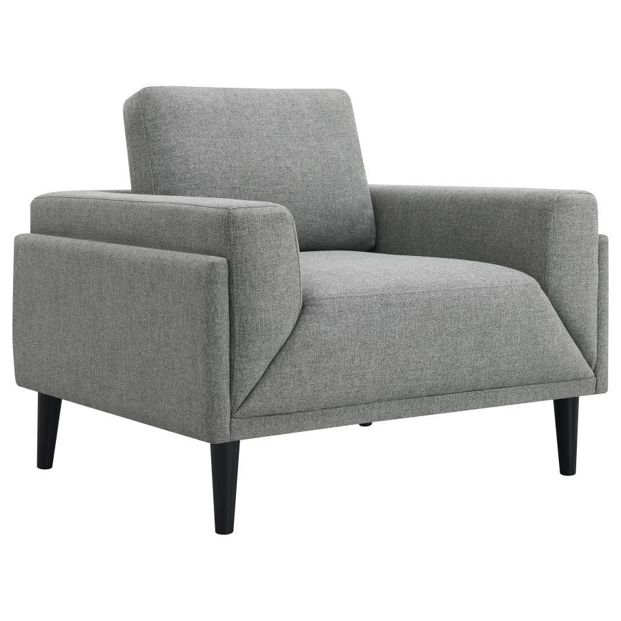 Unveiling our modern chair, where innovation meets elegance in a frame within a frame design. Adorned in a chic fabric, its streamlined silhouette is highlighted by meticulous topstitch details and track arms complemented by mitered front accents. Priorit