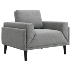 Unveiling our modern chair, where innovation meets elegance in a frame within a frame design. Adorned in a chic fabric, its streamlined silhouette is highlighted by meticulous topstitch details and track arms complemented by mitered front accents. Priorit