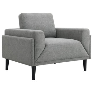 Unveiling our modern chair, where innovation meets elegance in a frame within a frame design. Adorned in a chic fabric, its streamlined silhouette is highlighted by meticulous topstitch details and track arms complemented by mitered front accents. Priorit