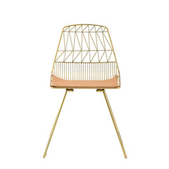 Modern elegance combined with contemporary design. This Fantasia side chair is stylish and durable. With its metal and faux leather craftsmanship, this piece will make a classy companion to any table. With its whiskey faux leather and gold finish, it will
