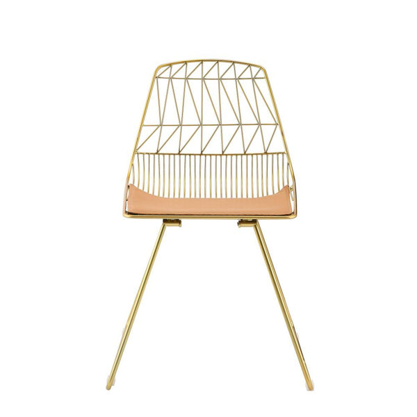 Modern elegance combined with contemporary design. This Fantasia side chair is stylish and durable. With its metal and faux leather craftsmanship, this piece will make a classy companion to any table. With its whiskey faux leather and gold finish, it will