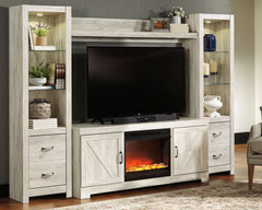 Express your farmhouse style with this entertainment center with fireplace insert. Its wispy white finish over replicated oak wood grain is a delightful change from the ordinary. Clean-lined, classic styling with barn door inspiration provides a country c