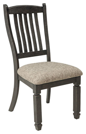 Invite your family into the heart of your home with this upholstered dining room chair. Its slat back and tapered legs, in a beautifully textured black finish, provide a sturdy foundation. And the heavily woven fabric on its boxed cushion seat has a quali