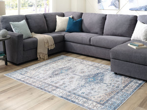  this rug adds an air of relaxed refinement to your decor. A distressed pattern in cream with shades of blue and beige keeps things casually cool underfoot. And when your rug needs a little R&R