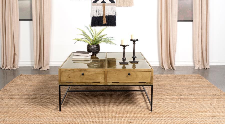 Bring farmhouse charm to your living room with this shadowbox coffee table. A tempered glass top offers a clear view of treasures stored in four compartments, accessed by drop-front doors with chain suspension for a unique touch. Crafted from solid mango 