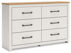 Create a serene countryside retreat with this dresser. The two-tone design effortlessly adds farmhouse style, while framed drawer fronts with pewter-tone handles enhance its charming appeal. Looking for furniture that offers storage and a peaceful escape 