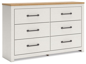 Create a serene countryside retreat with this dresser. The two-tone design effortlessly adds farmhouse style, while framed drawer fronts with pewter-tone handles enhance its charming appeal. Looking for furniture that offers storage and a peaceful escape 
